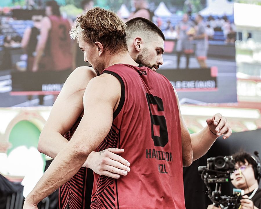 Basketball players embracing/celebrating